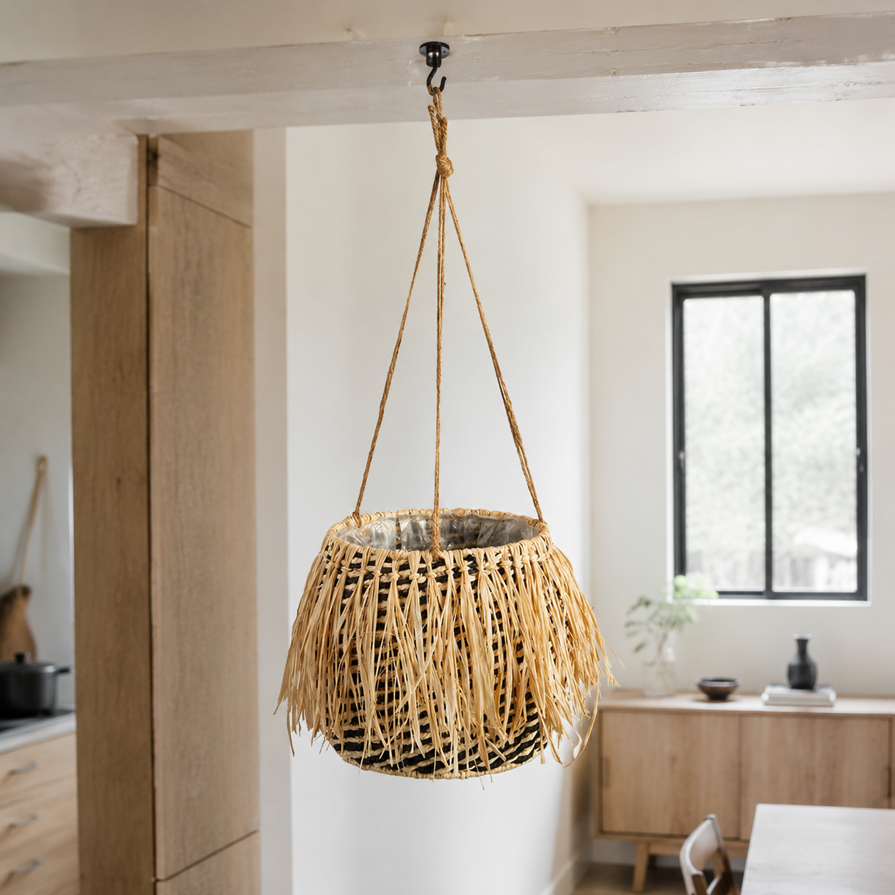 Raffia Hanging Planter — An ornamental raffia planter suspended on rope — easy texture for a patio, kitchen or garden.